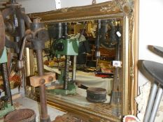 A large gilt framed bevel edged mirror. a/f.