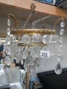 A small four tier brass and glass chandelier, incomplete.