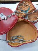 A heart shaped jewellery box with Diamonte jewellery