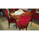 A good quality Italian inlaid mahogany table with four chairs.
