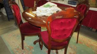 A good quality Italian inlaid mahogany table with four chairs.