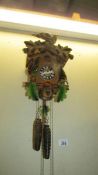 A vintage black forest German cuckoo clock