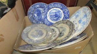 A box of old blue and white plates.
