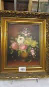 A gilt framed oil on canvas still life of roses.