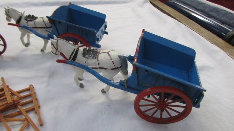 Two Britain's farm carts and a hay rake all with plastic horses. - Image 2 of 3