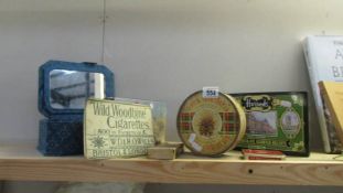 A quantity of vintage tins and boxes.