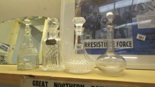 Four vintage decanters 1 with a silver Hallmarked whiskey label (collect only).