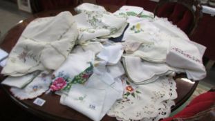 A mixed lot of embroidered tablecloths, napkins etc.