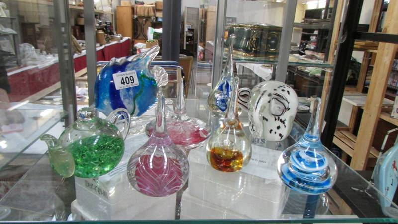 A good lot of glass paperweights.