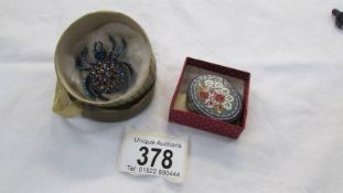 An Italian gilded pill box with micro mosaic lid and a decorative blue stone spider brooch.