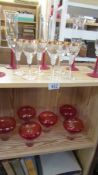 Two shelves of decorative glasses.