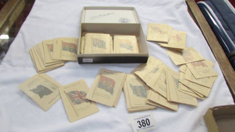 A quantity of silk cigarette cards depicting flags.