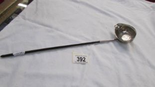 A Georgian silver plate wine ladle/taster with coin inset to base.