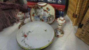 A Japanese pair candlesticks and plate and a Chinese bowl