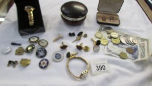 A mixed lot including watches, cuff links, badges, coins etc.