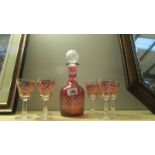 A cut glass overlaid ruby decanter and 6 glasses