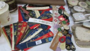A large quantity of leather book marks and assorted key rings.