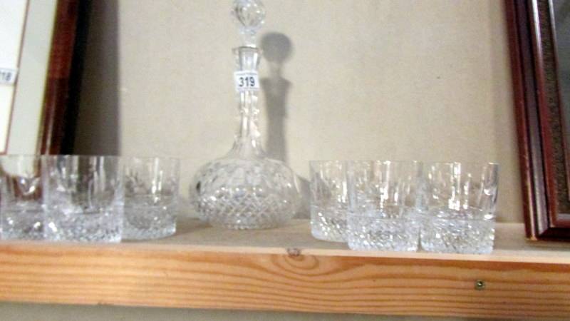 A cut glass decanter and 6 whisky glasses