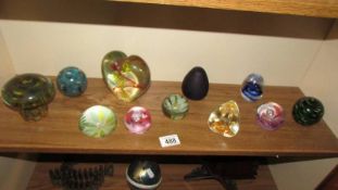 A good lot of glass paperweights.