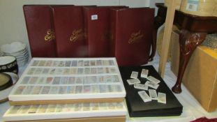 A large quantity of reproduction sets of cigarette cards and albums and card sleeves etc