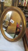 A small oval mirror.