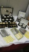 A good lot of cased and uncased cutlery and a pair of glass salts in case