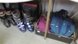 Two pairs of Salomon ski boots in original bags marked 24.5 and 28.
