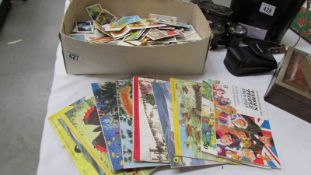 A collection of Brooke Bond tea cards including a quantity of unused albums.