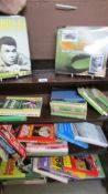A quantity of sport related books.