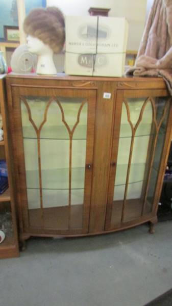 A mid 20th century glazed display cabinet.
