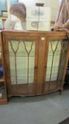 A mid 20th century glazed display cabinet.