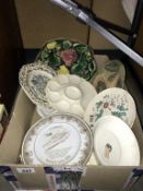 A box of antique and vintage plates.