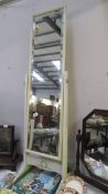 A cheval style bedroom mirror in white frame. (collect only).