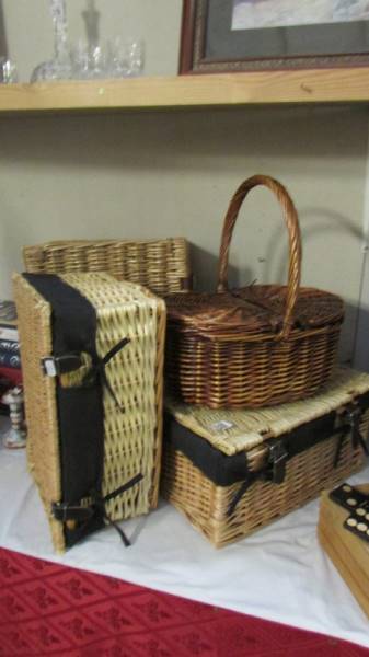 3 wicker/rattan hampers and a lidded basket