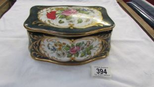 A decorative porcelain lidded box.