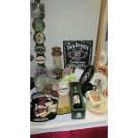 A large quantity of vintage breweriana pub items including ashtrays, pump clips, glasses,