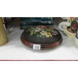 A Victorian style button footstool with floral tapestry top
