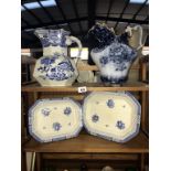 Two large blue and white bathroom ewer's and two meat platters.