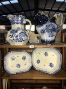 Two large blue and white bathroom ewer's and two meat platters.