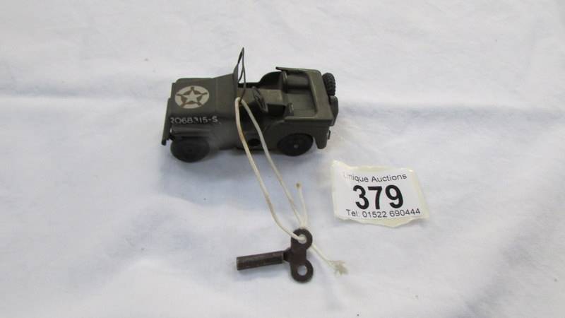 A Triang Minic tinplate clockwork military jeep.