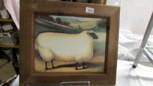 A pine framed print of a sheep