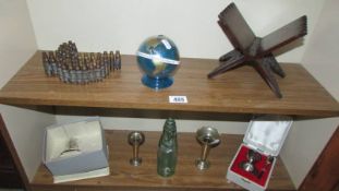 A mixed lot including bras shell cases, globe money box, silver plate,