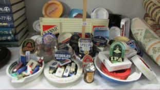 A quantity of vintage breweriana including ashtrays, lighters, glasses etc.