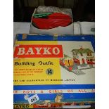 A Bayko building outfit No, 14 and a box of parts, completion unknown.