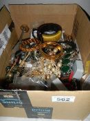 A box of assorted costume jewellery.