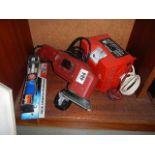 A battery charger, sander etc.,
