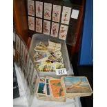 A quantity of cigarette cards etc.,