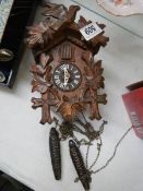 A cuckoo clock, missing pendulum.