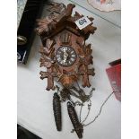 A cuckoo clock, missing pendulum.
