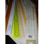 A quantity of rulers including slide rule.